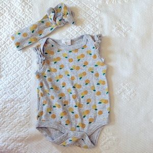 Orange print newborn onesie